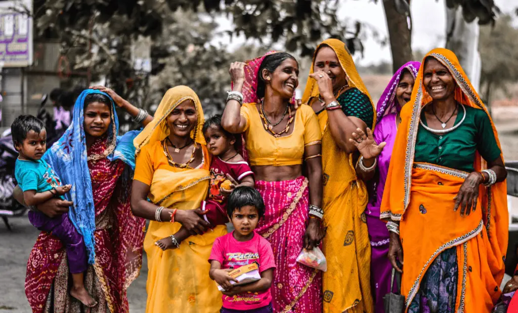 group of women in bright traditional clothing. happytogetheranywhere.com