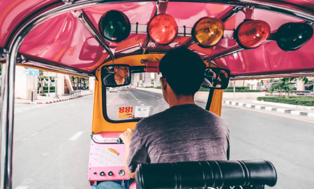 sitting behind a tuktuk driver. happytogetheranywhere.com