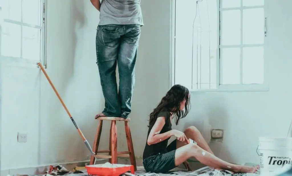 couple painting a room together. happytogetheranywhere.com